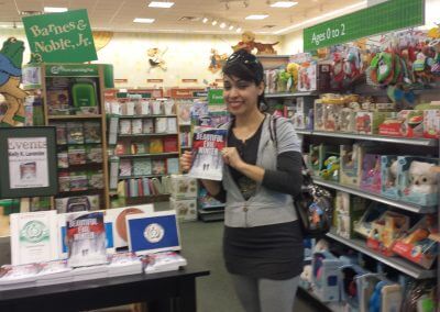 A reader displays her copy of Beautiful Evil Winter at Kelly K. Lavender's Barnes & Noble Booksigning