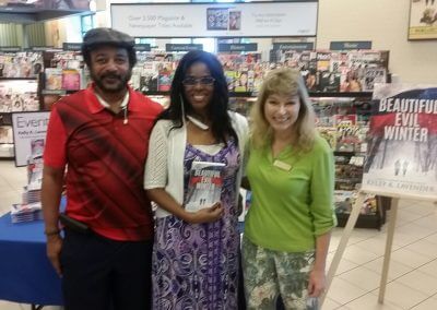 Kelly K. Lavender poses with two readers at her Beautiful Evil Winter booksigning at Barnes & Noble