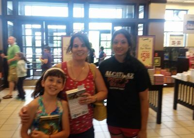 Two women and one girl pose at Kelly K. Lavender's Barnes & Noble Booksigning